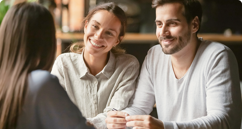 Couple talking to woman