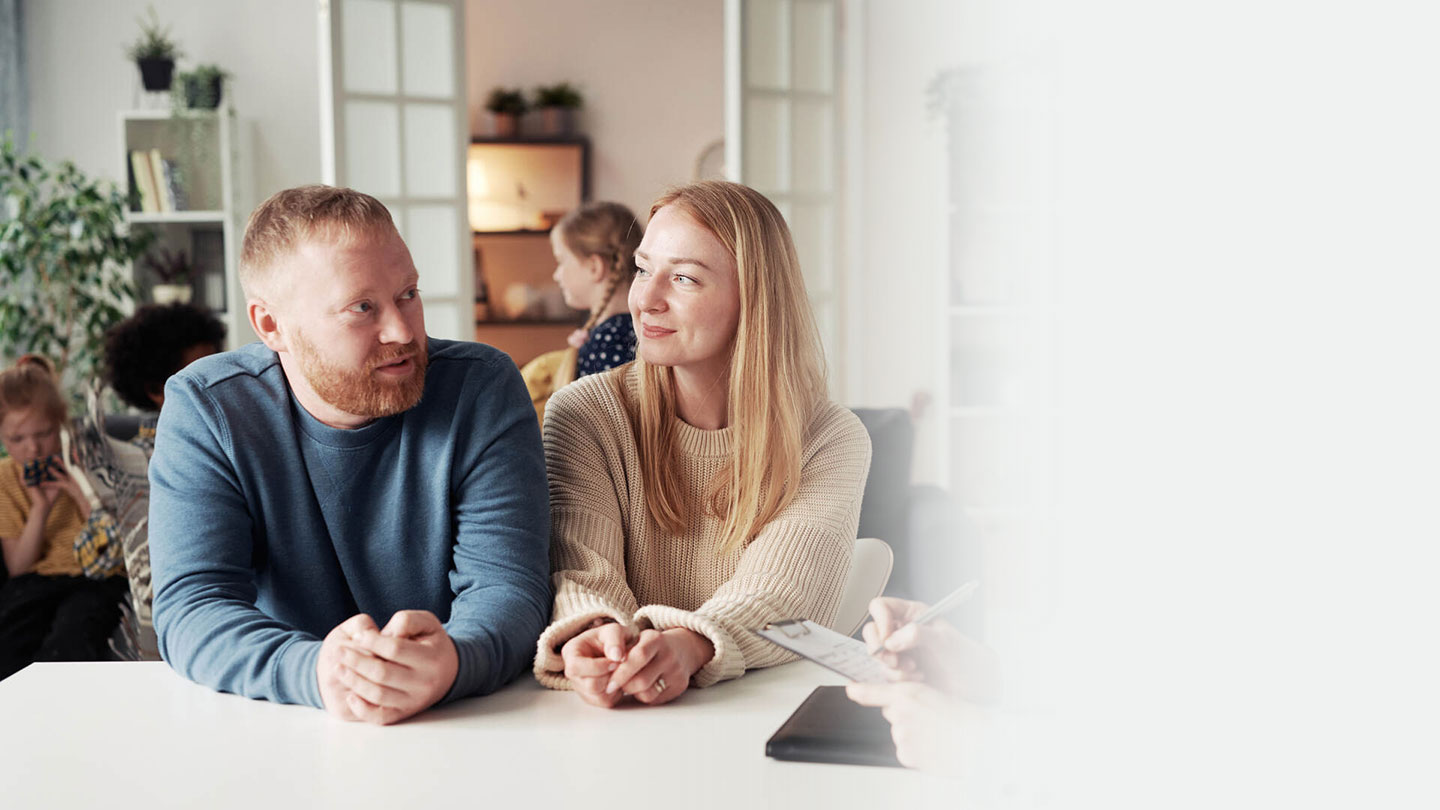 Couple talking to social worker about adoption